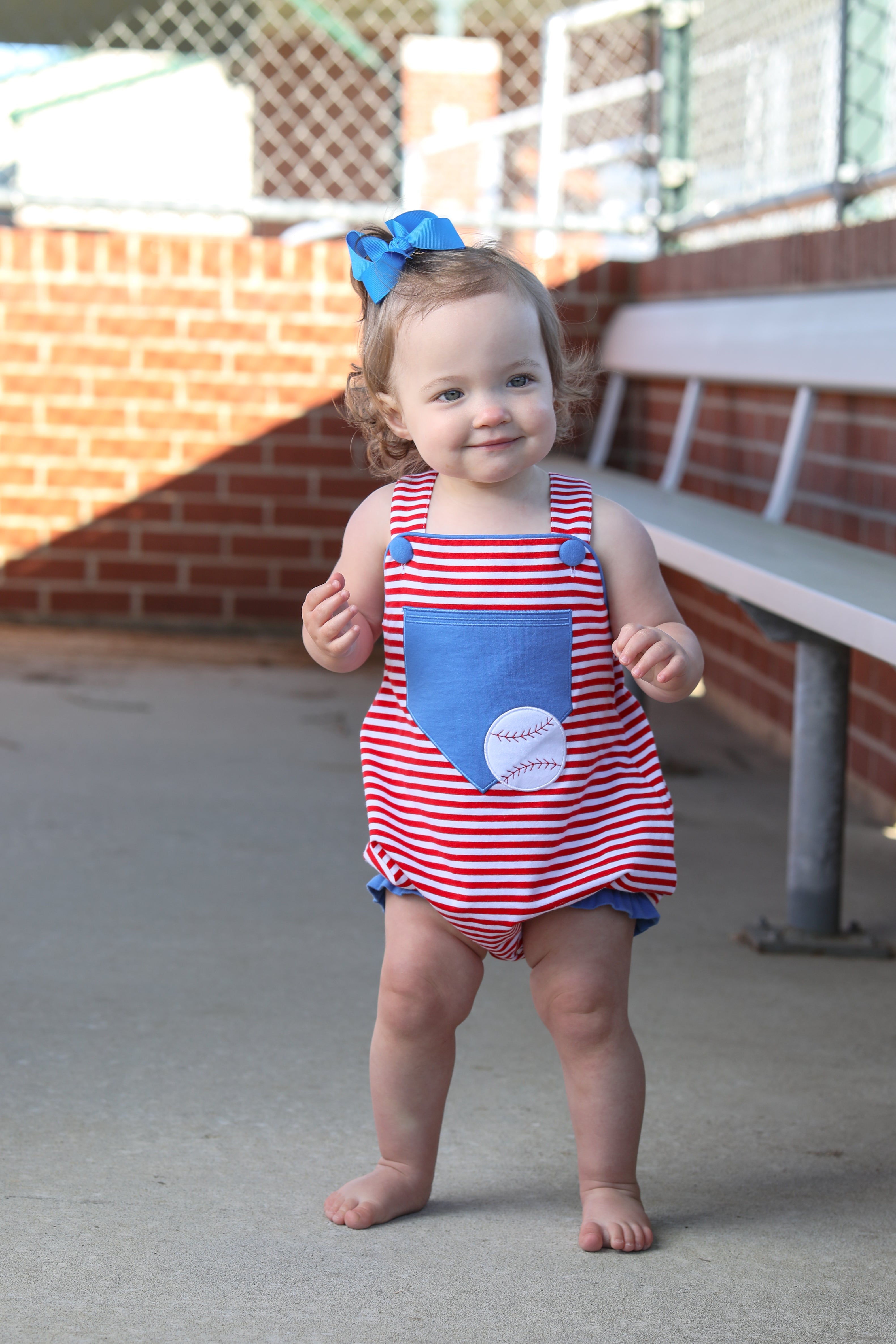 Baseball Pocket Ruffle Sunsuit by Trotter Street
