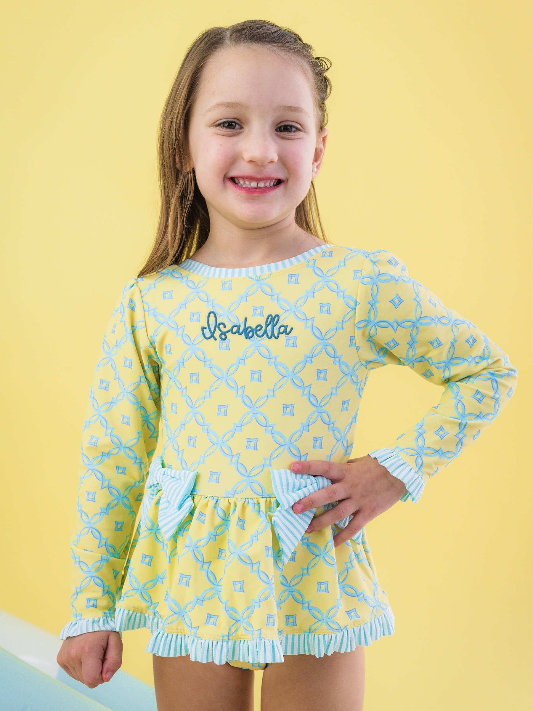 Girls Banana Coastal Charm Long Sleeve One Piece Bow Peplum Rash Guard Swimsuit